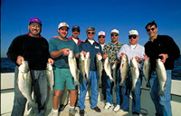 men posing with the catches